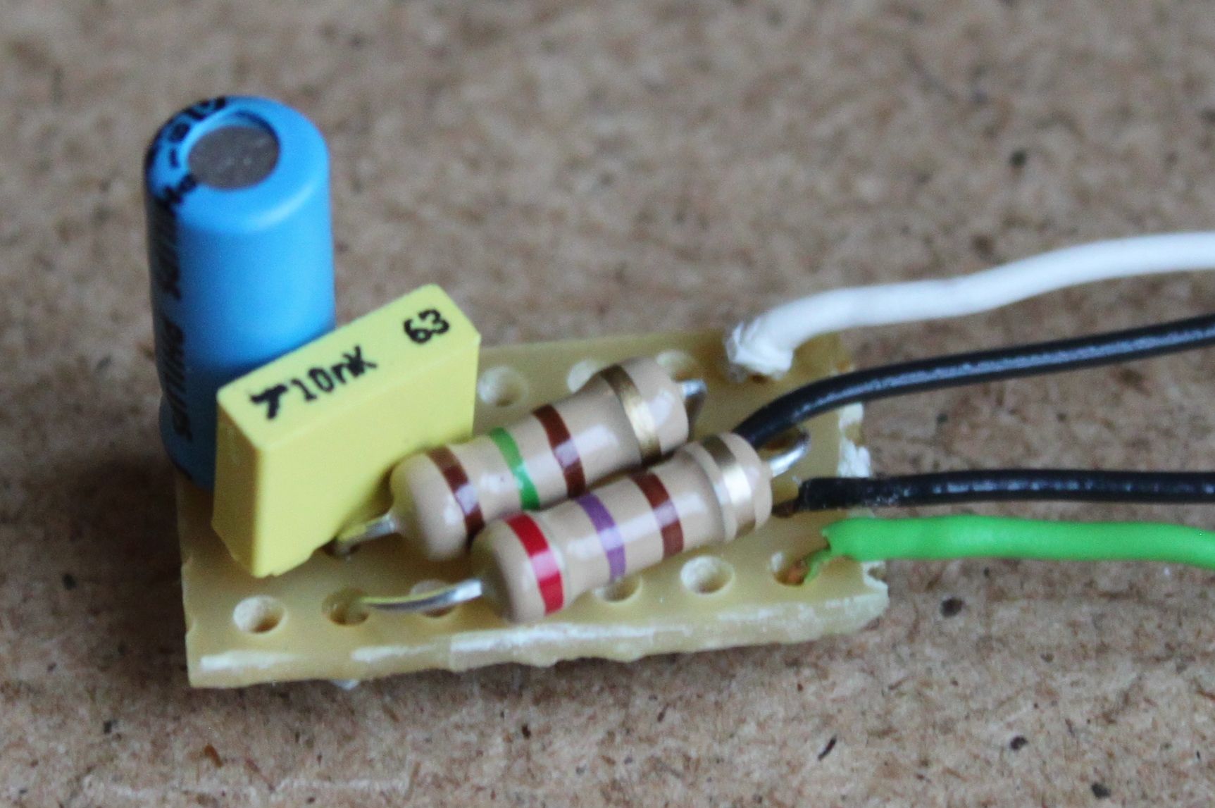 The low pass filter constructed from two capacitors and two resistors on a protoboard.