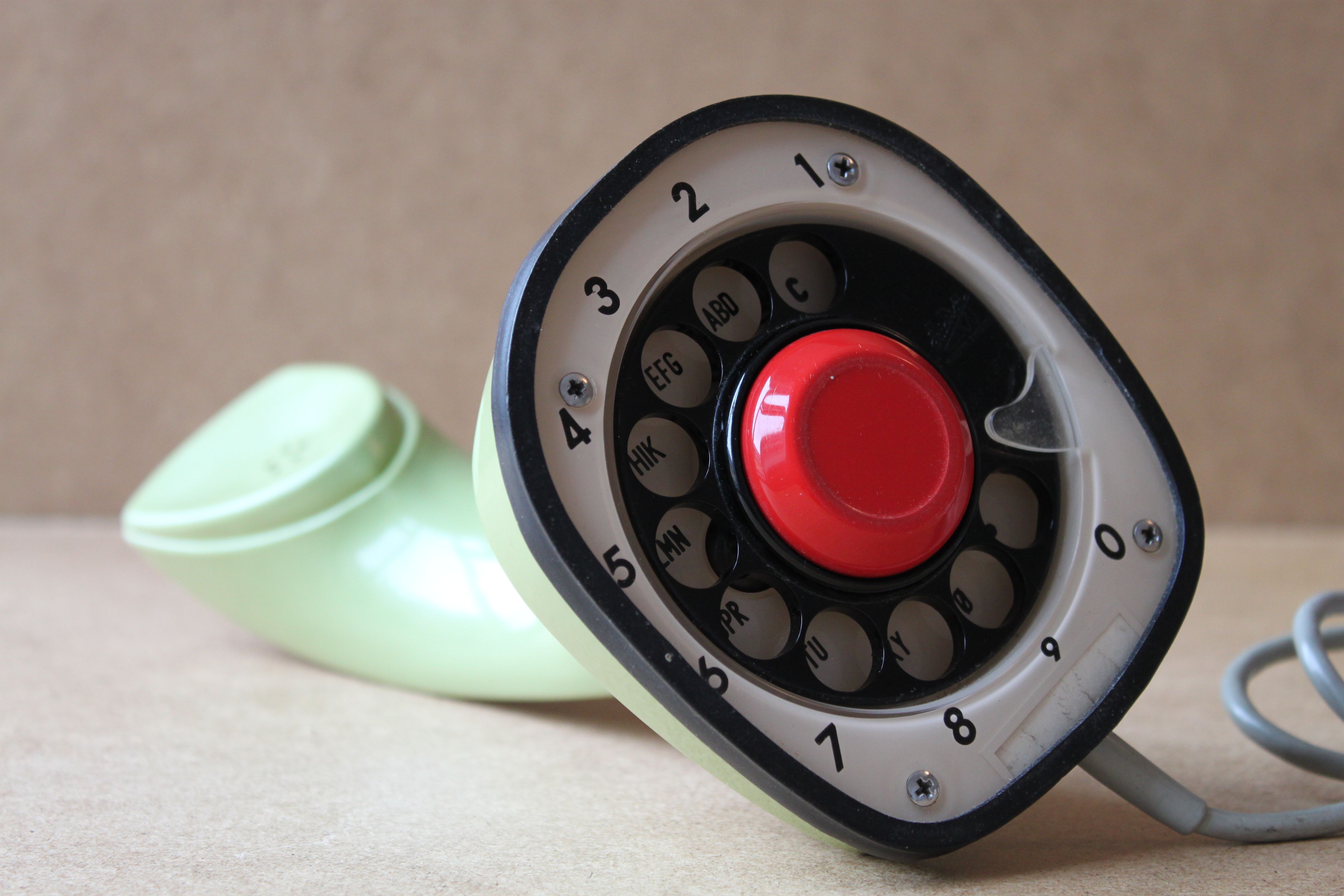 The unmodified Ericofon laying on its side, exposing its dial