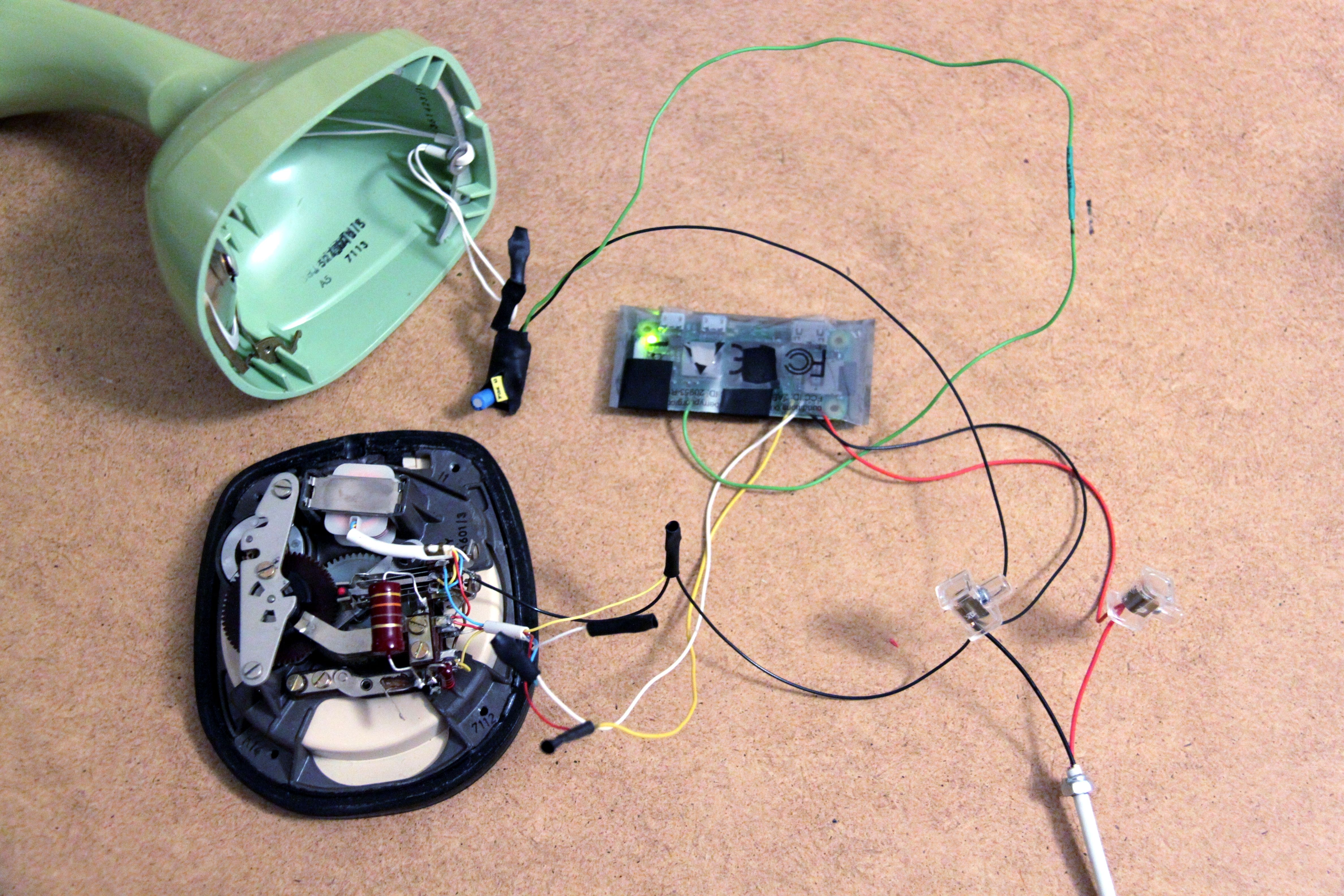 The opened Ericofon with the Raspberry Pi wired up.